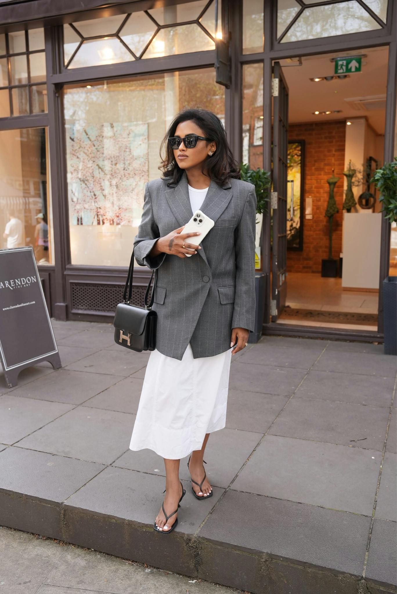 Spring outfit, workwear, spring style, Hermes Constance , oversized blazer, pinstriped blazer, white skirt