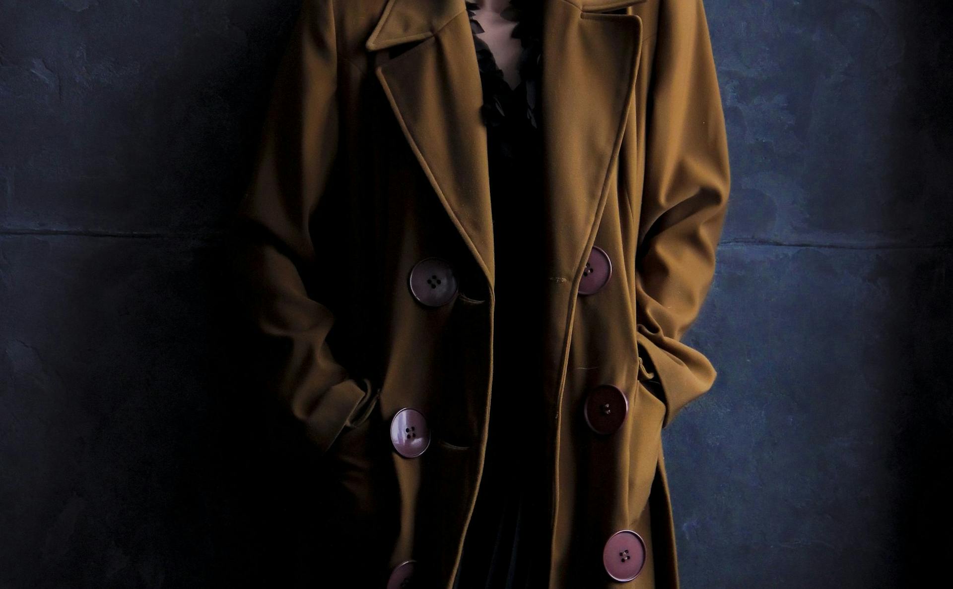 Person wearing a brown coat