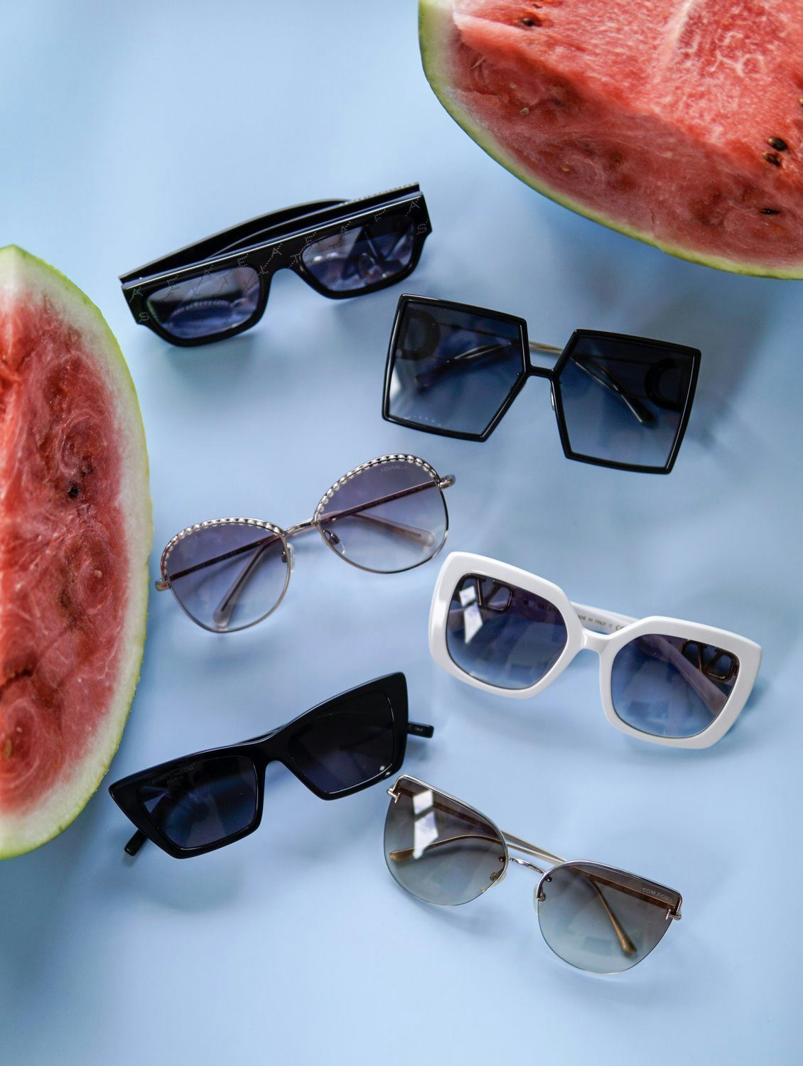 6 sunglasses between 2 slices of watermelon
