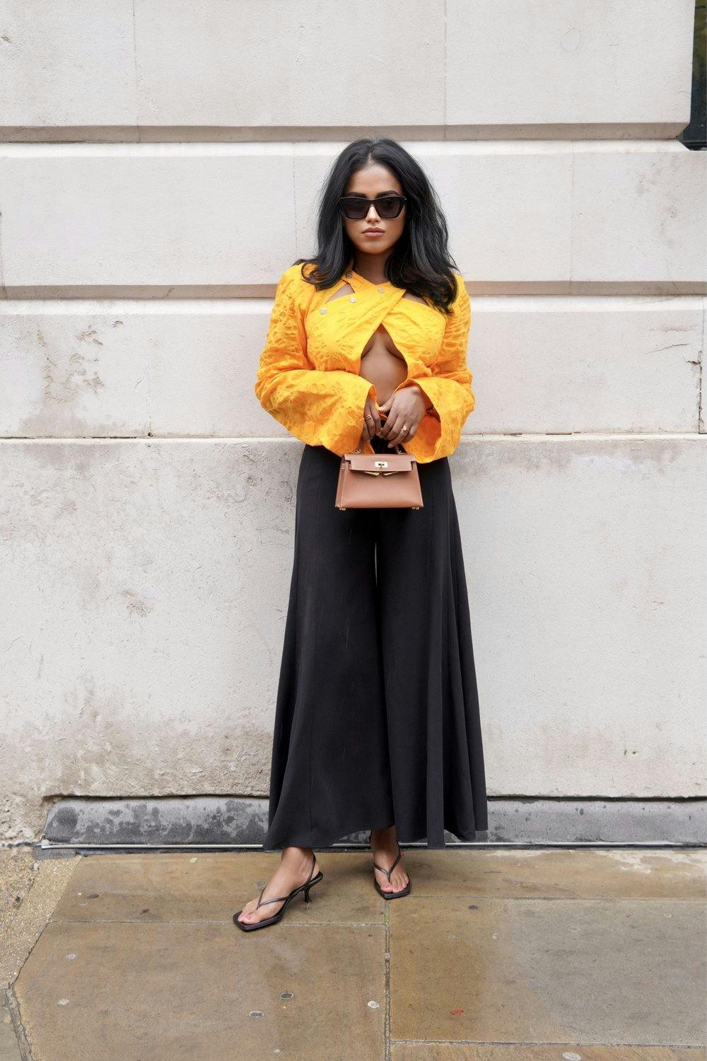 Sachini wearing Nanushka Top at London Fashion Week
