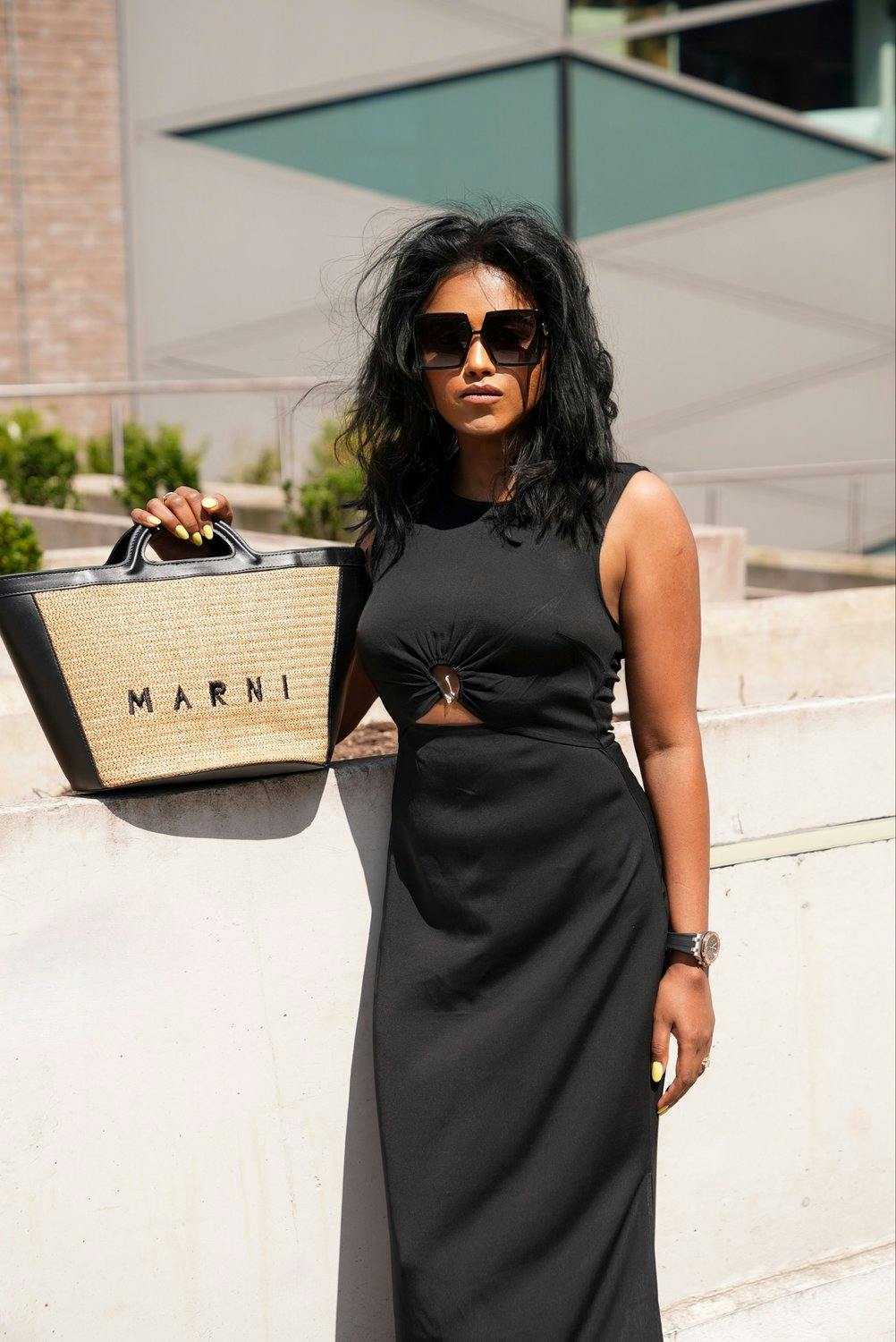 Sachini Dilanka wearing a Black Dress and a Marni bag