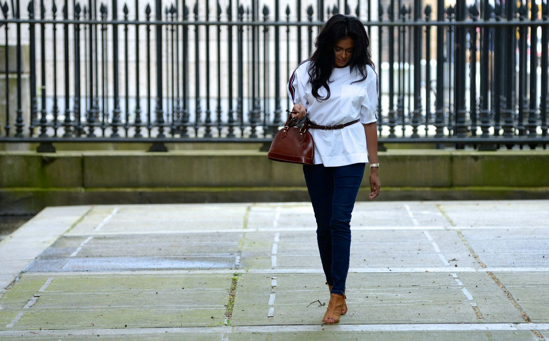 Sachini wearing jeans and a white top