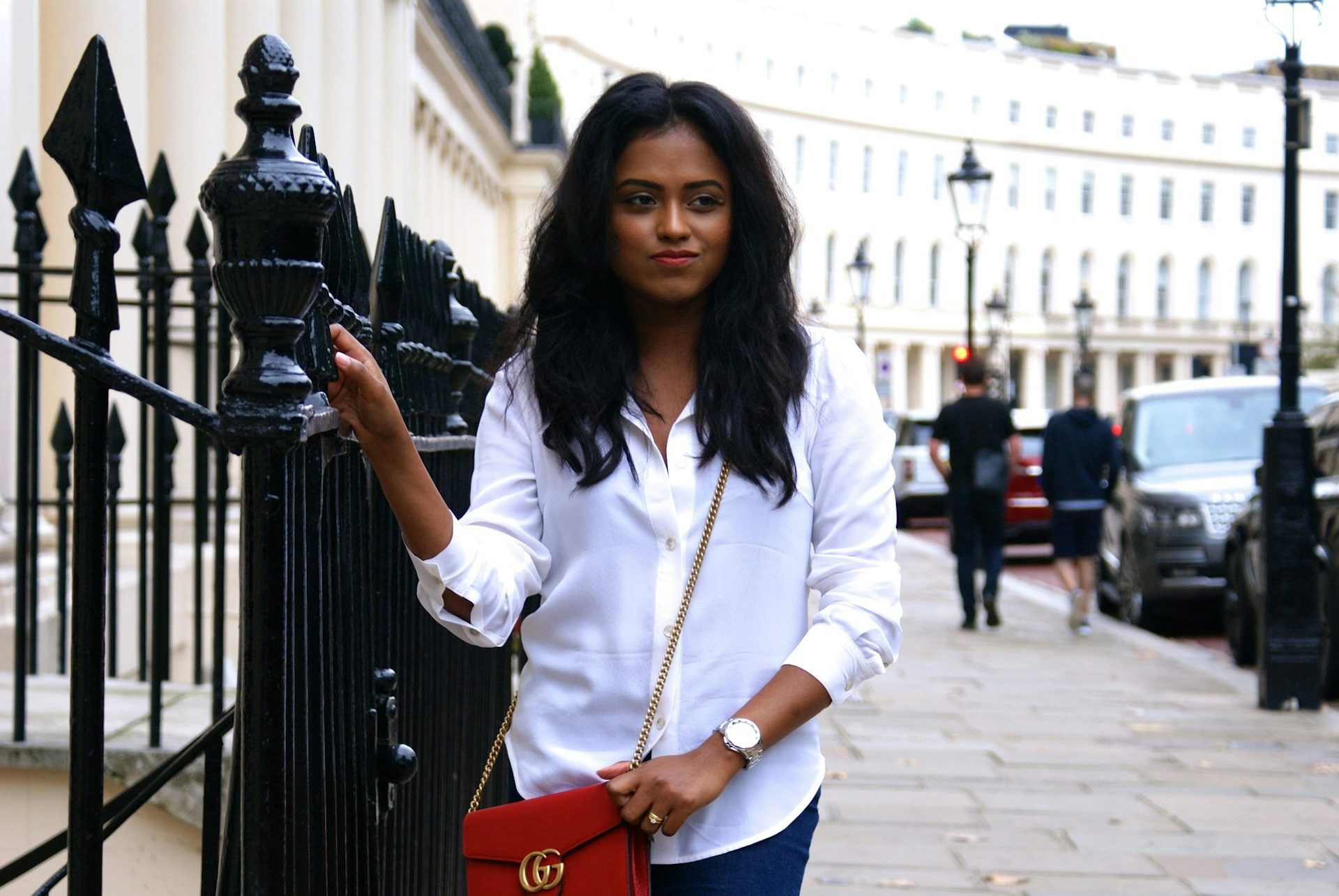 Sachini with a white top and a Gucci bag